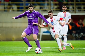 LEON, SPAIN - OCTOBER 26:  Alvaro Morata of Real Madrid duels for the ball with Ivan Gonzalez of Cultural Leonesa during the Copa del Rey Round of 32 match between Cultural Leonesa and Real Madrid CF at Reino de Leon Stadium on October 26, 2016 in Leon, S