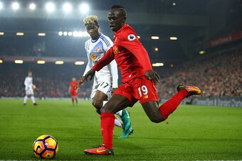 LIVERPOOL, ENGLAND - NOVEMBER 26:  Sadio Mane of Liverpool and Dider Ndong of Sunderland compete for the ball during the Premier League match between Liverpool and Sunderland at Anfield on November 26, 2016 in Liverpool, England.  (Photo by Clive Brunskil