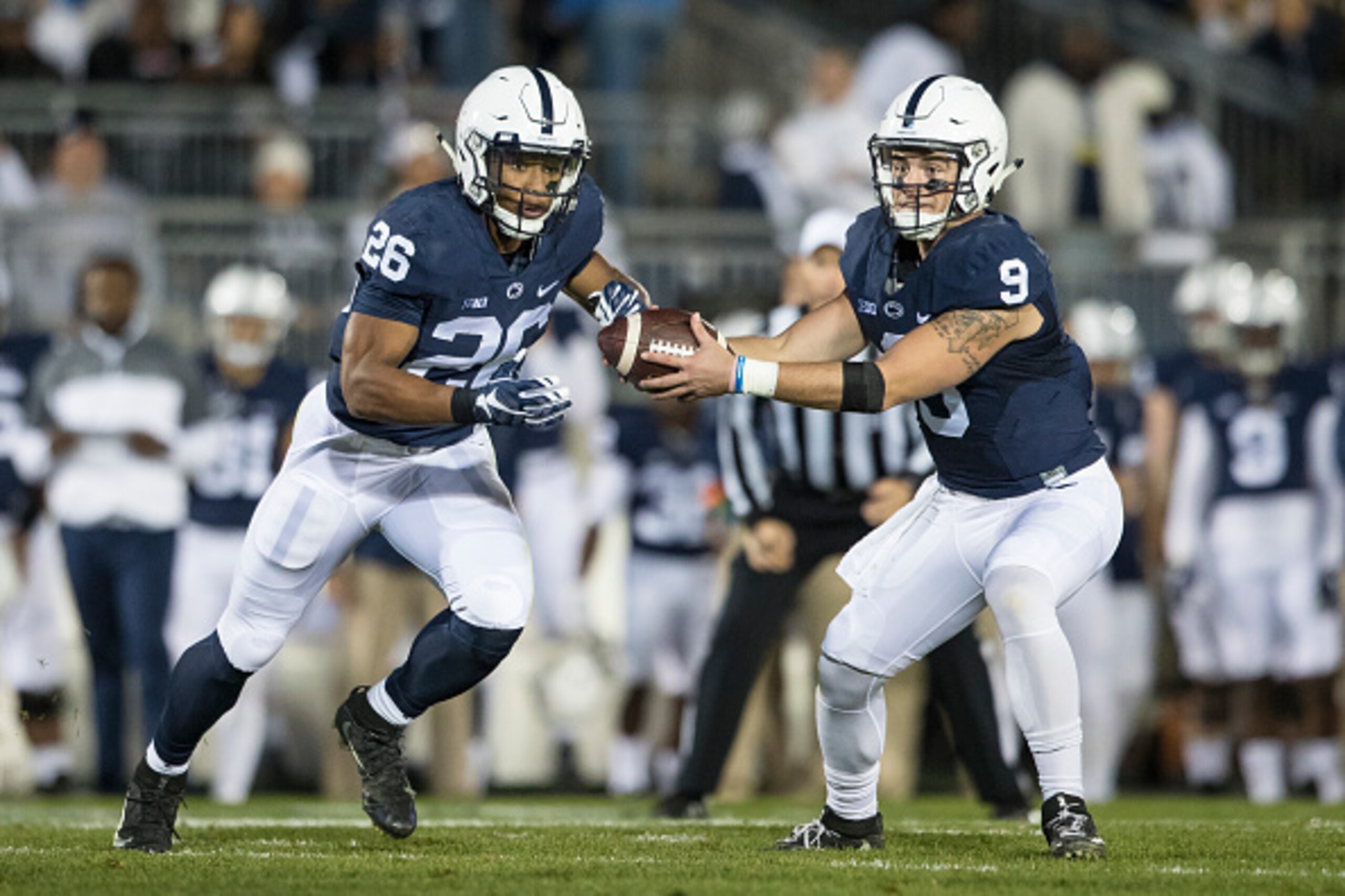 STATE COLLEGE, PA - NOVEMBER 05: Trace McSorley #9 fakes a hand off to Saquon Barkley #26 of the Penn State Nittany Lions during the game against the Iowa Hawkeyes on November 5, 2016 at Beaver Stadium in State College, Pennsylvania. Penn State defeats I STATE COLLEGE, PA - NOVEMBER 05: Trace McSorley #9 fakes a hand off to Saquon Barkley #26 of the Penn State Nittany Lions during the game against the Iowa Hawkeyes on November 5, 2016 at Beaver Stadium in State College, Pennsylvania. Penn State defeats I