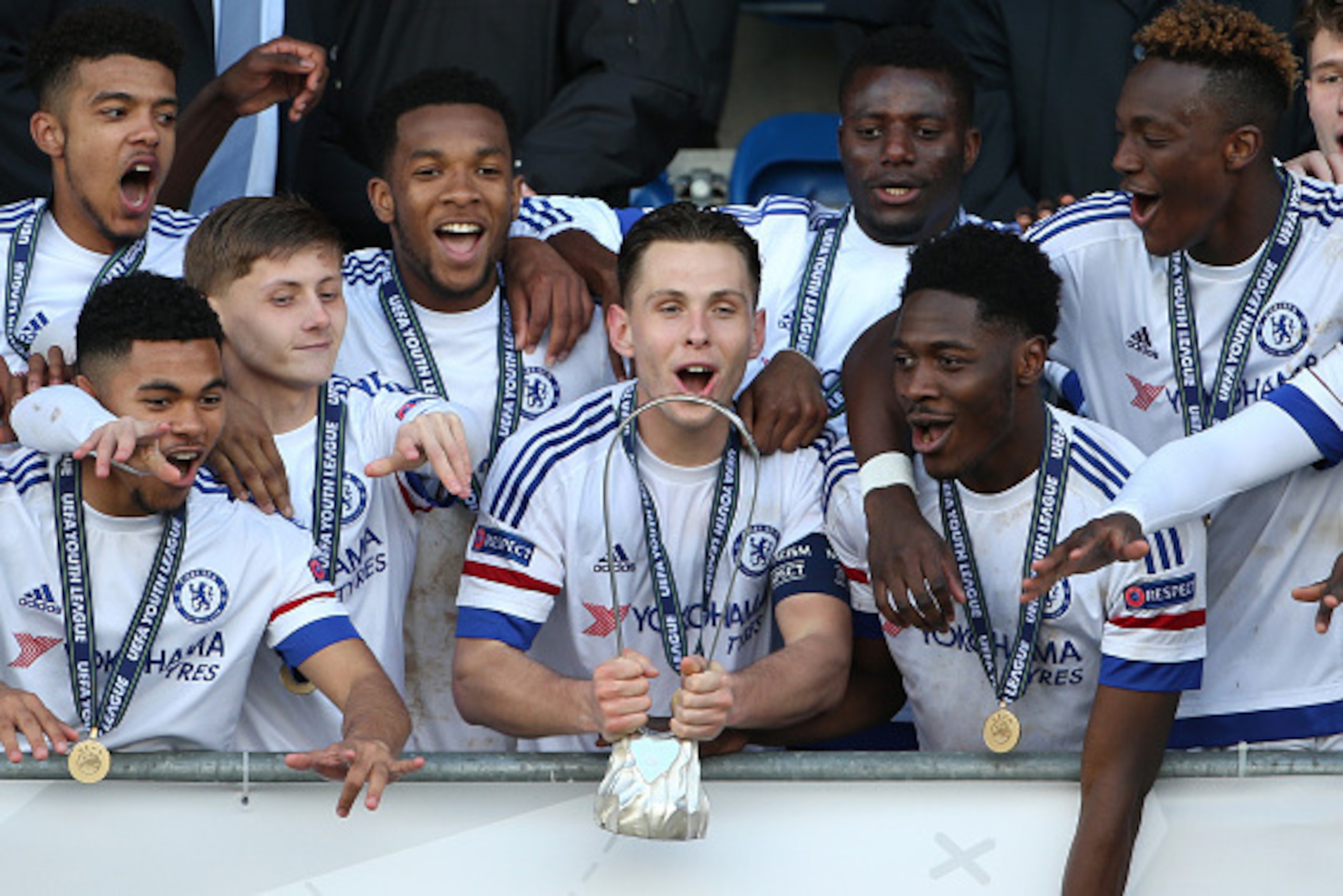 NYON, SWITZERLAND - APRIL 18: Charlie Colkett of Chelsea FC (C) lifts the UEFA Youth League trophy in celebration after victoy in the UEFA Youth League Final match between Paris Saint Germain and Chelsea FC at Colovray Stadion on April 18, 2016 in Nyon, S