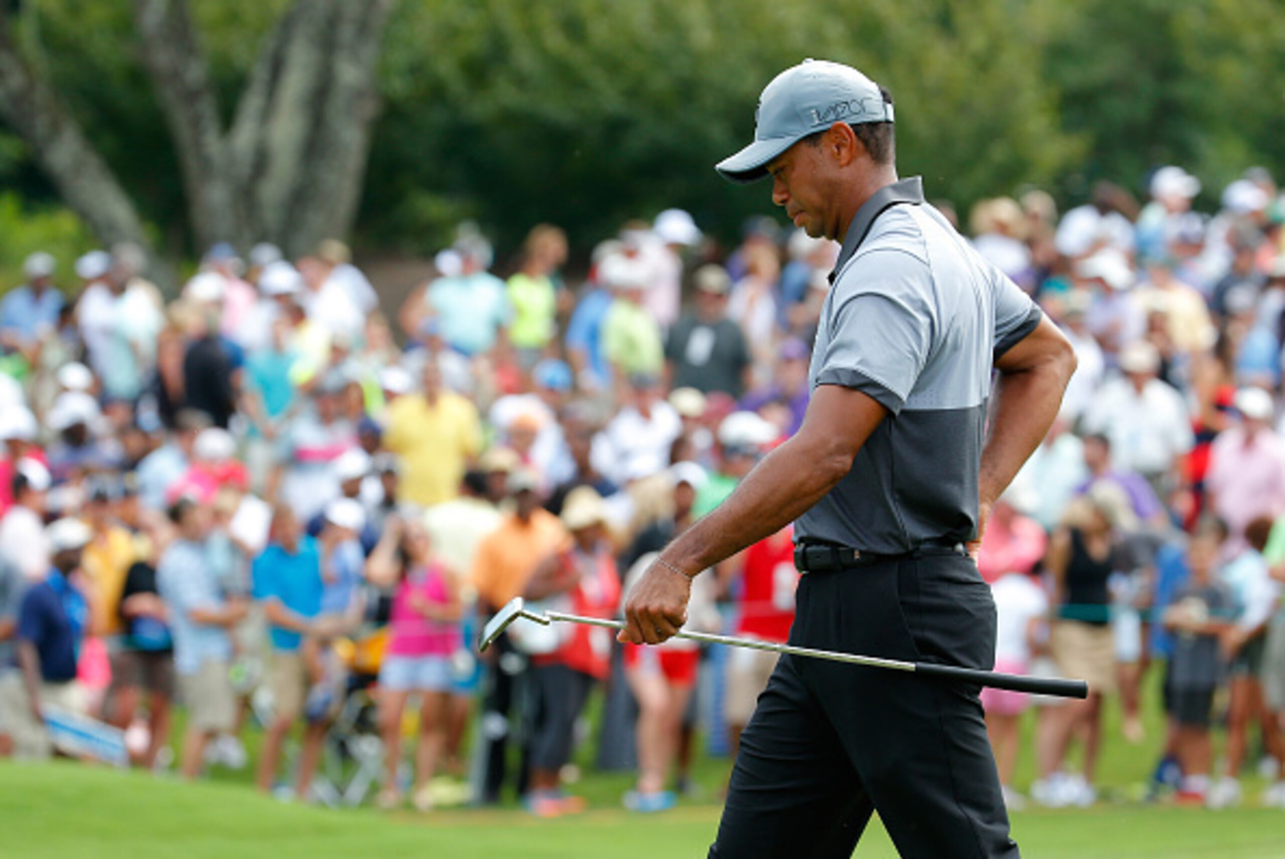 GREENSBORO, NC - AUGUST 22: Tiger Woods walks off the ninth green during the third round of the Wyndham Championship at Sedgefield Country Club on August 22, 2015 in Greensboro, North Carolina. (Photo by Kevin C. Cox/Getty Images) GREENSBORO, NC - AUGUST 22: Tiger Woods walks off the ninth green during the third round of the Wyndham Championship at Sedgefield Country Club on August 22, 2015 in Greensboro, North Carolina. (Photo by Kevin C. Cox/Getty Images)