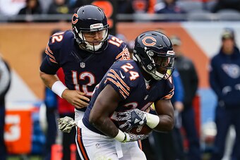 CHICAGO, IL - NOVEMBER 27:  Quarterback  Matt Barkley #12 of the Chicago Bears hands the football offsides to  Jordan Howard #24 in the second quarter against the Tennessee Titans at Soldier Field on November 27, 2016 in Chicago, Illinois.  (Photo by Jona