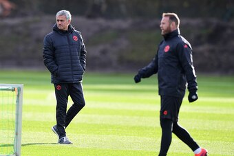 MANCHESTER, ENGLAND - NOVEMBER 23:  Jose Mourinho manager of Manchester United and Wayne Rooney look on during a Manchester United training session on the eve of their UEFA Europa League match against Feyenoord at Aon Training Complex on November 23, 2016