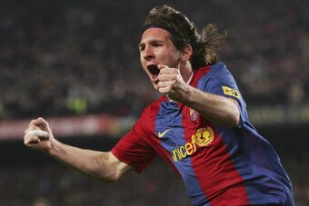 BARCELONA, SPAIN - MARCH 10:  Lionel Messi of  Barcelona celebrates after scoring their second goal during the Primera Liga match between Barcelona and Real Madrid at the Nou Camp stadium on March 10, 2007 in Barcelona, Spain.  (Photo by Denis Doyle/Getty