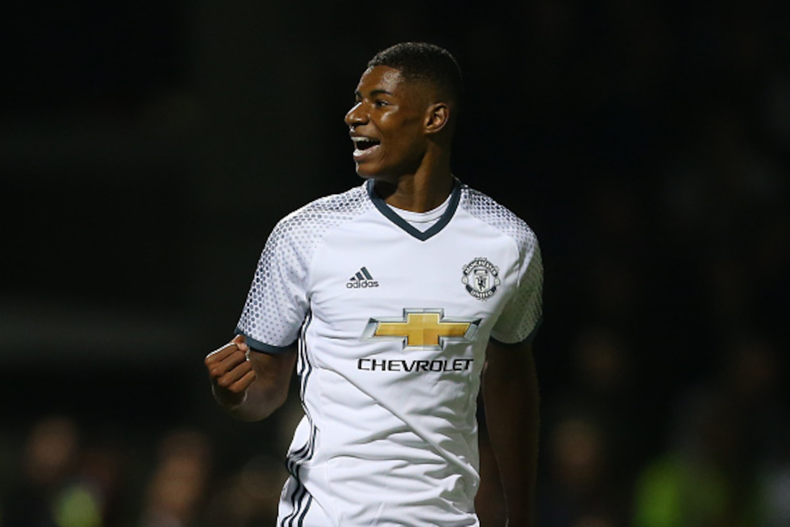 NORTHAMPTON, ENGLAND - SEPTEMBER 21: Marcus Rashford of Manchester United celebrates after he scores a goal to make it 1-3 during the EFL Cup match between Northampton Town and Manchester United at Sixfields on September 21, 2016 in Northampton, England. 