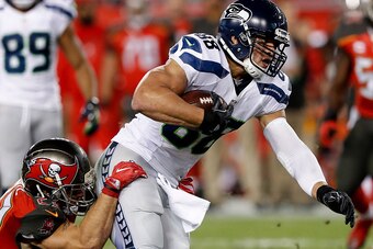 TAMPA, FL - NOVEMBER 27: Tight end Jimmy Graham #88 of the Seattle Seahawks is tackled by Safety Chris Conte #23 of the Tampa Bay Buccaneers during the game at Raymond James Stadium on November 27, 2016 in Tampa, Florida. The Bucs defeated the Seahawks 14
