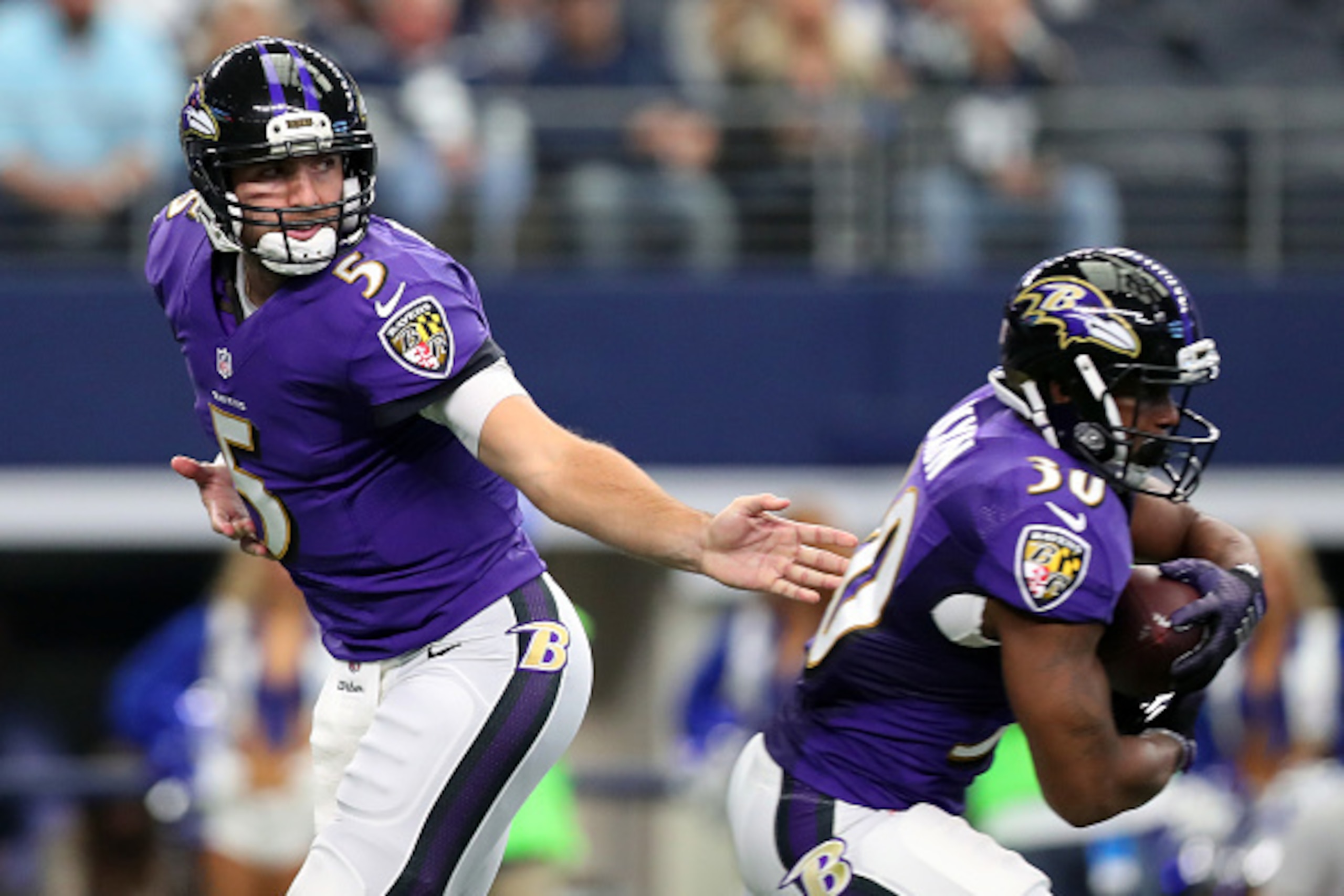 ARLINGTON, TX - NOVEMBER 20:   Joe Flacco hands off to Kenneth Dixon #30 of the Baltimore Ravens during the first quarter against the Dallas Cowboys at AT&T Stadium on November 20, 2016 in Arlington, Texas.  (Photo by Tom Pennington/Getty Images)