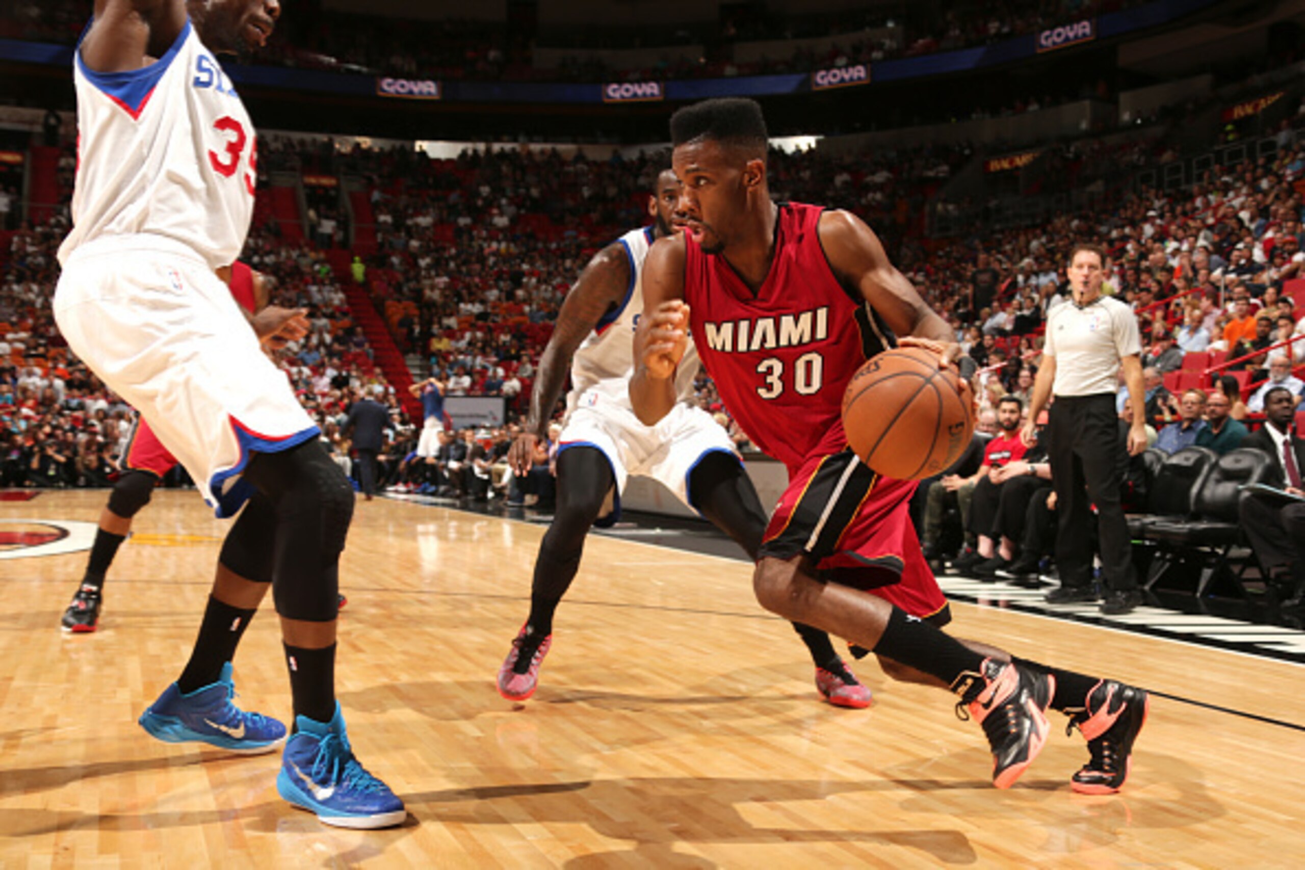 MIAMI, FL - December 23:  Norris Cole #30 of the Miami Heat handles the ball against the Philadelphia 76ers on December 23, 2014 at American Airlines Arena in Miami, Florida. NOTE TO USER: User expressly acknowledges and agrees that, by downloading and or