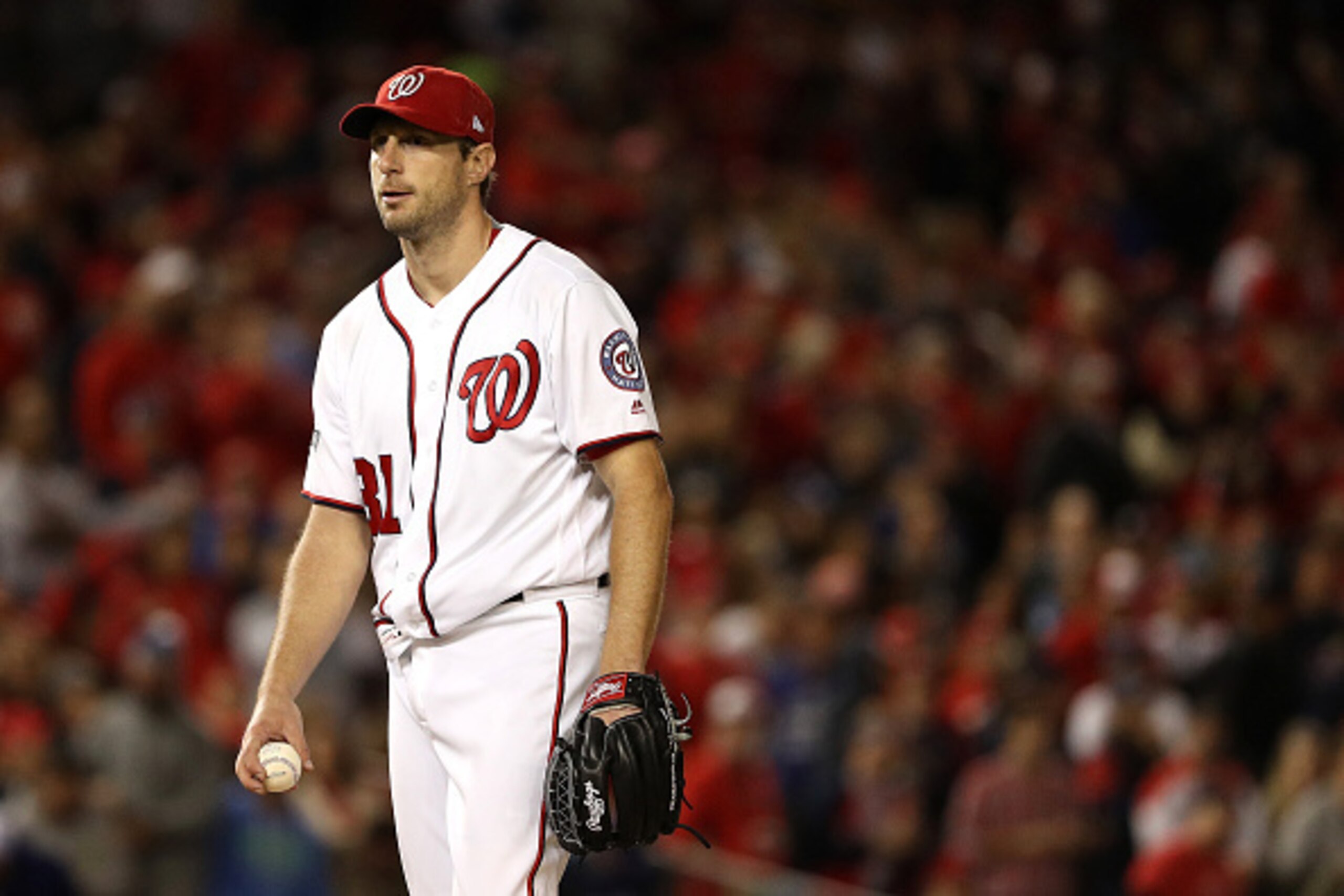 WASHINGTON, DC - OCTOBER 13: Max Scherzer #31 of the Washington Nationals looks on after giving up a solo home run hit by Joc Pederson #31 of the Los Angeles Dodgers (not pictured) in the seventh inning during game five of the National League Division Ser