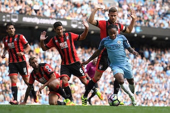 MANCHESTER, ENGLAND - SEPTEMBER 17:  Raheem Sterling of Manchester City burst through the AFC Bournemouth defence during the Premier League match between Manchester City and AFC Bournemouth at Etihad Stadium on September 17, 2016 in Manchester, England.  