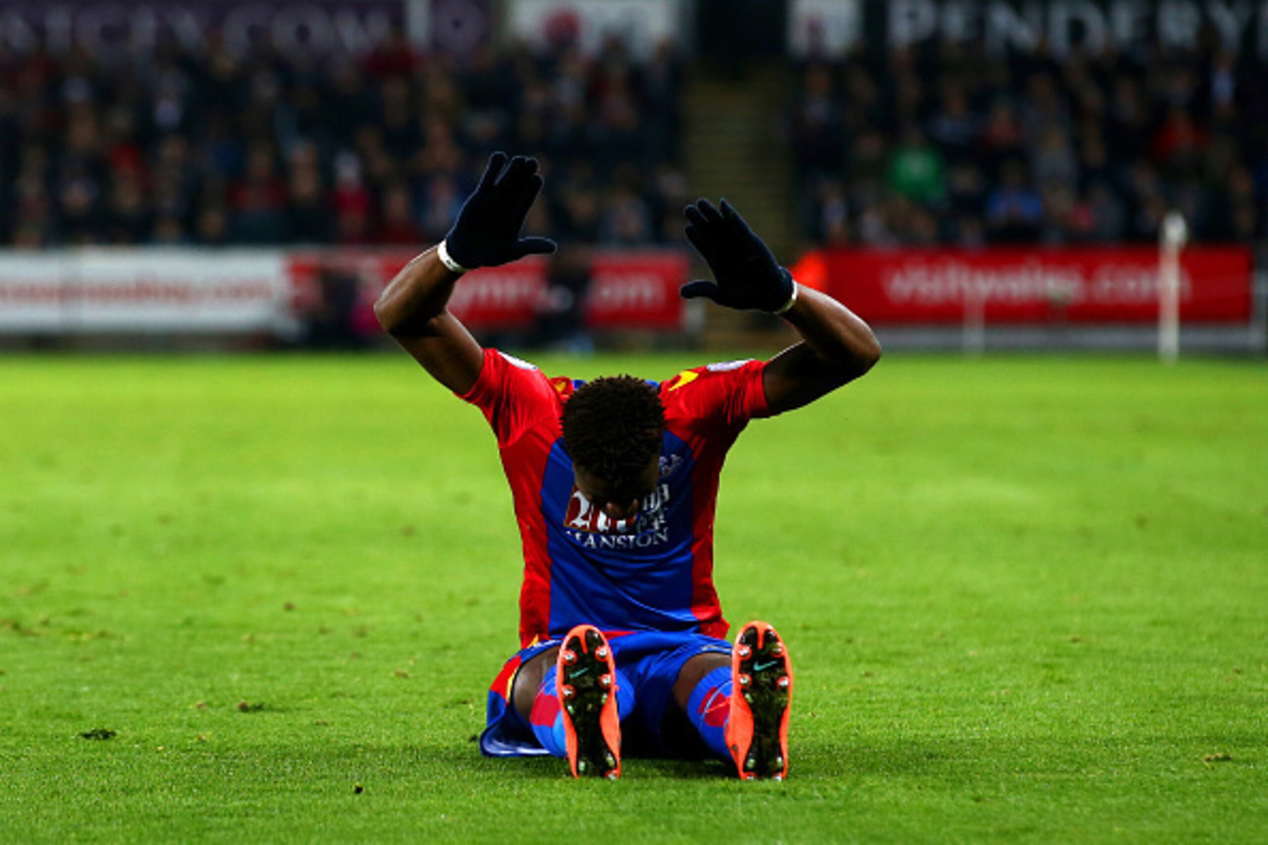 SWANSEA, WALES - NOVEMBER 26:  Wilfried Zaha of Crystal Palace reacts during the Premier League match between Swansea City and Crystal Palace at Liberty Stadium on November 26, 2016 in Swansea, Wales.  (Photo by Jan Kruger/Getty Images)