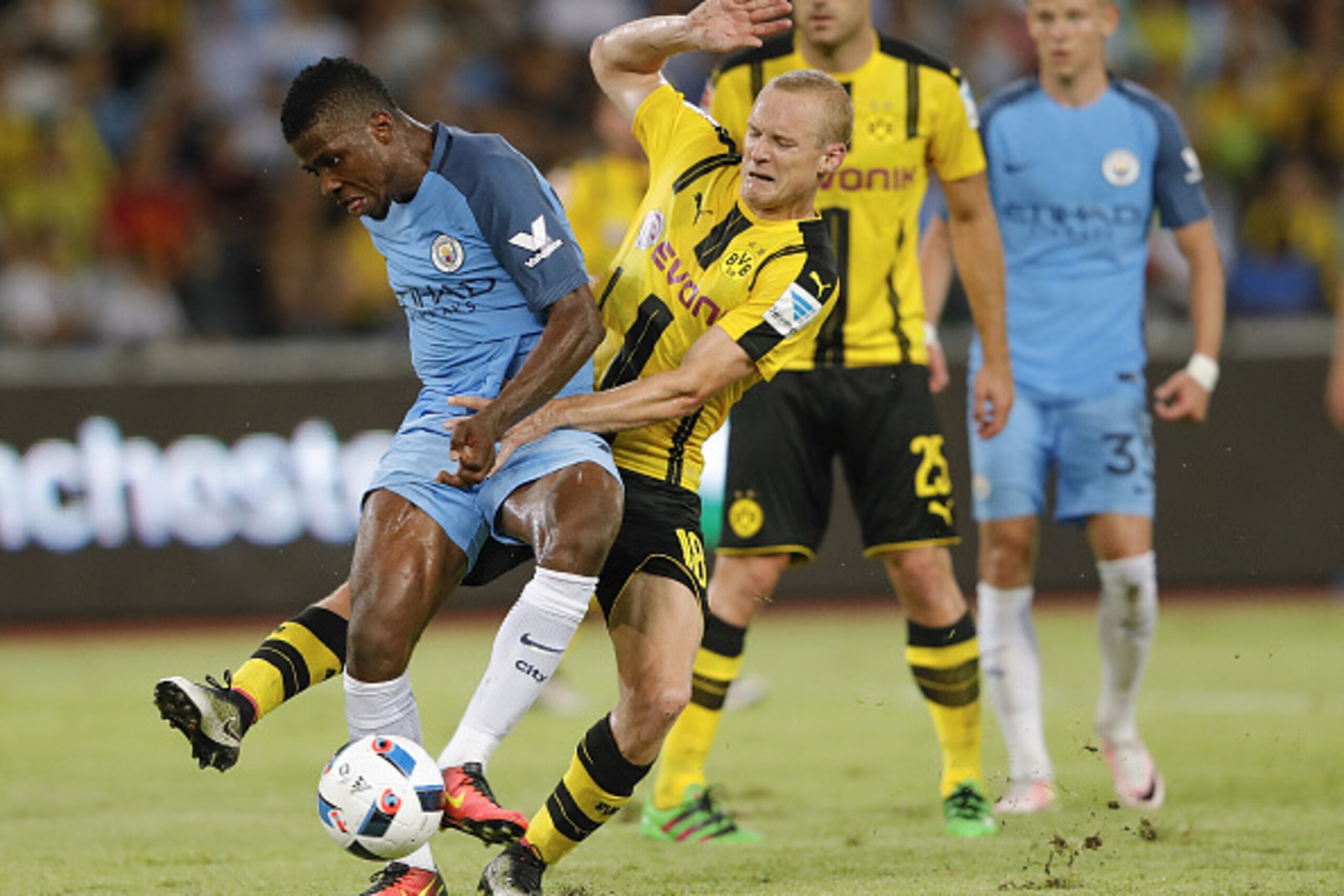 SHENZHEN, CHINA - JULY 28:  Kelechi Iheanacho (#72) of Manchester City contests the ball against Sebastian Rode of Borussia Dortmund during the 2016 International Champions Cup match between Manchester City and Borussia Dortmund at Shenzhen Universiade St