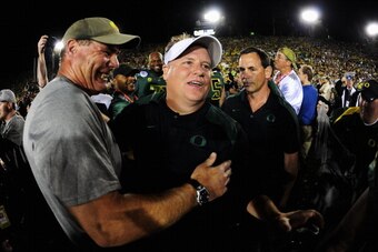 PASADENA, CA - JANUARY 02:  Head coach Chip Kelly of the Oregon Ducks celebrates after the Ducks 45-38 victory over the Wisconsin Badgers at the 98th Rose Bowl Game on January 2, 2012 in Pasadena, California.  (Photo by Harry How/Getty Images)