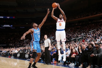 NEW YORK, NY - NOVEMBER 28:  Justin Holiday #8 of the New York Knicks shoots the ball against Jerami Grant #9 of the Oklahoma City Thunder during the game on November 28, 2016 at Madison Square Garden in New York City, New York.  NOTE TO USER: User expres