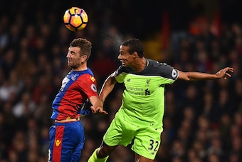 Liverpool's German-born Cameroonian defender Joel Matip (R) vies with Crystal Palace's Scottish midfielder James McArthur during the English Premier League football match between Crystal Palace and Liverpool at Selhurst Park in south London on October 29,