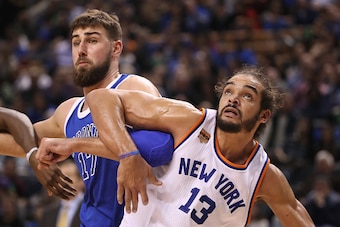 TORONTO, ON - NOVEMBER 12: Joakim Noah #13 of the New York Knicks battles for a rebound against Jonas Valanciunas #17 of the Toronto Raptors during NBA game action at Air Canada Centre on November 12, 2016 in Toronto, Canada. NOTE TO USER: User expressly 