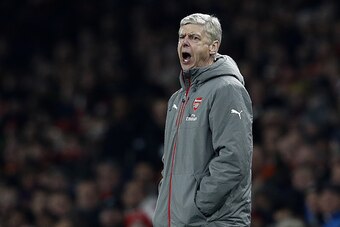 Arsenal's French manager Arsene Wenger shouts instructions to his players from the touchline during the EFL (English Football League) Cup quarter-final football match between Arsenal and Southampton at the Emirates Stadium in London on November 30, 2016. 