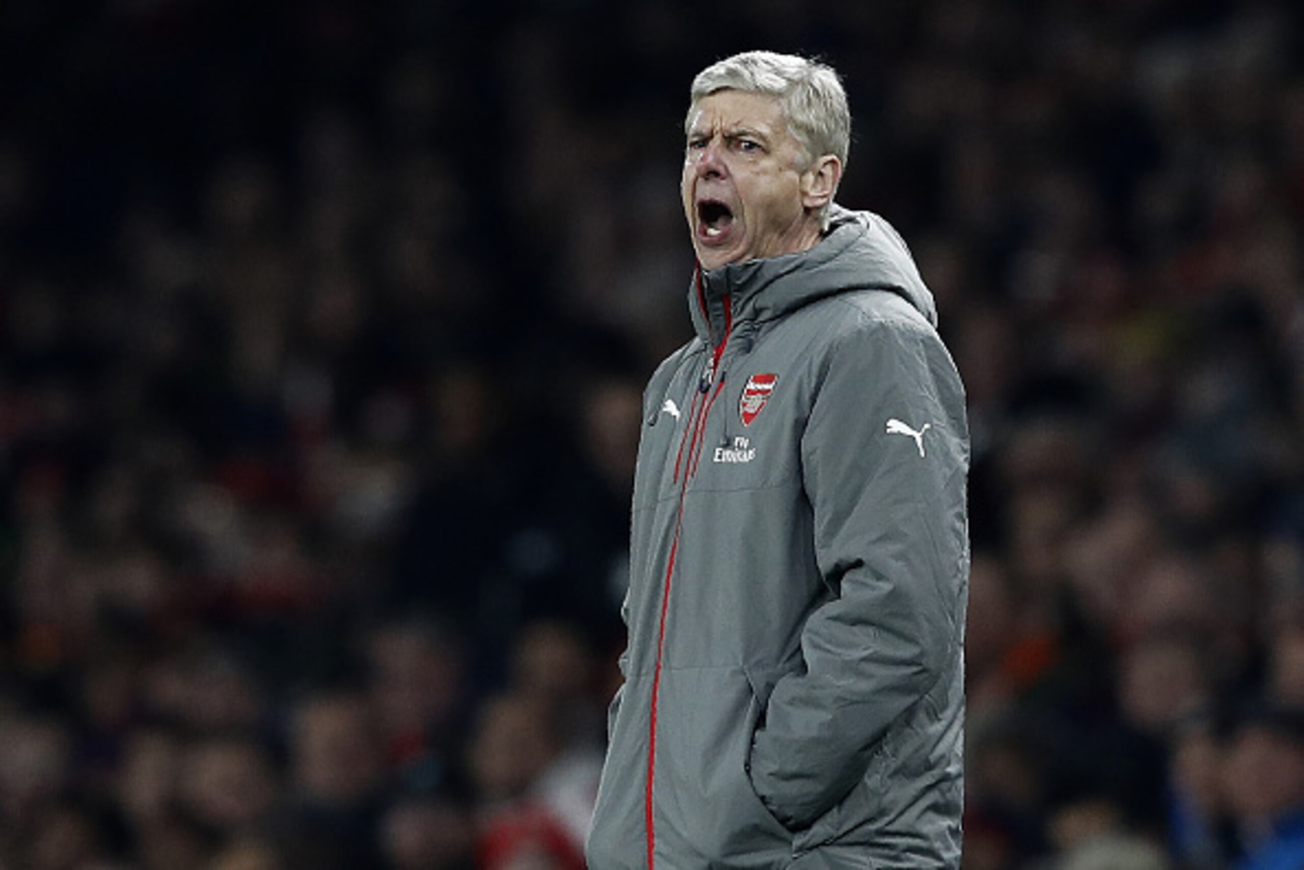 Arsenal's French manager Arsene Wenger shouts instructions to his players from the touchline during the EFL (English Football League) Cup quarter-final football match between Arsenal and Southampton at the Emirates Stadium in London on November 30, 2016. 