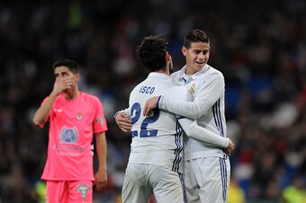 MADRID, SPAIN - NOVEMBER 30:  James Rodriguez of Real Madrid CF reacts with Isco after Isco narrowly failed to score a goal during the Copa del Rey last of 32 match between Real Madrid and Cultural Leonesa at estadio Santiago Bernabeu on November 30, 2016