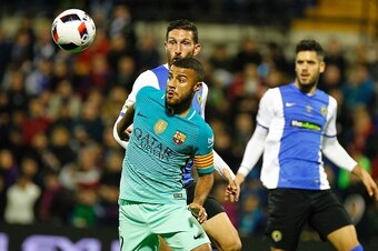 Hercules' defender Jose Manuel Rojas (L) vies with Barcelona's Brazilian midfielder Rafinha during the Spanish Copa del Rey (King's Cup) round of 32 first leg football match Hercules CF vs FC Barcelona at the Estadio Jose Rico Perez in Alicante on Novembe