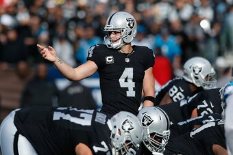 OAKLAND, CA - NOVEMBER 27: Derek Carr #4 of the Oakland Riders signals to teammates in the second quarter against the Carolina Panthers on November 27, 2016 in Oakland, California. (Photo by Lachlan Cunningham/Getty Images)