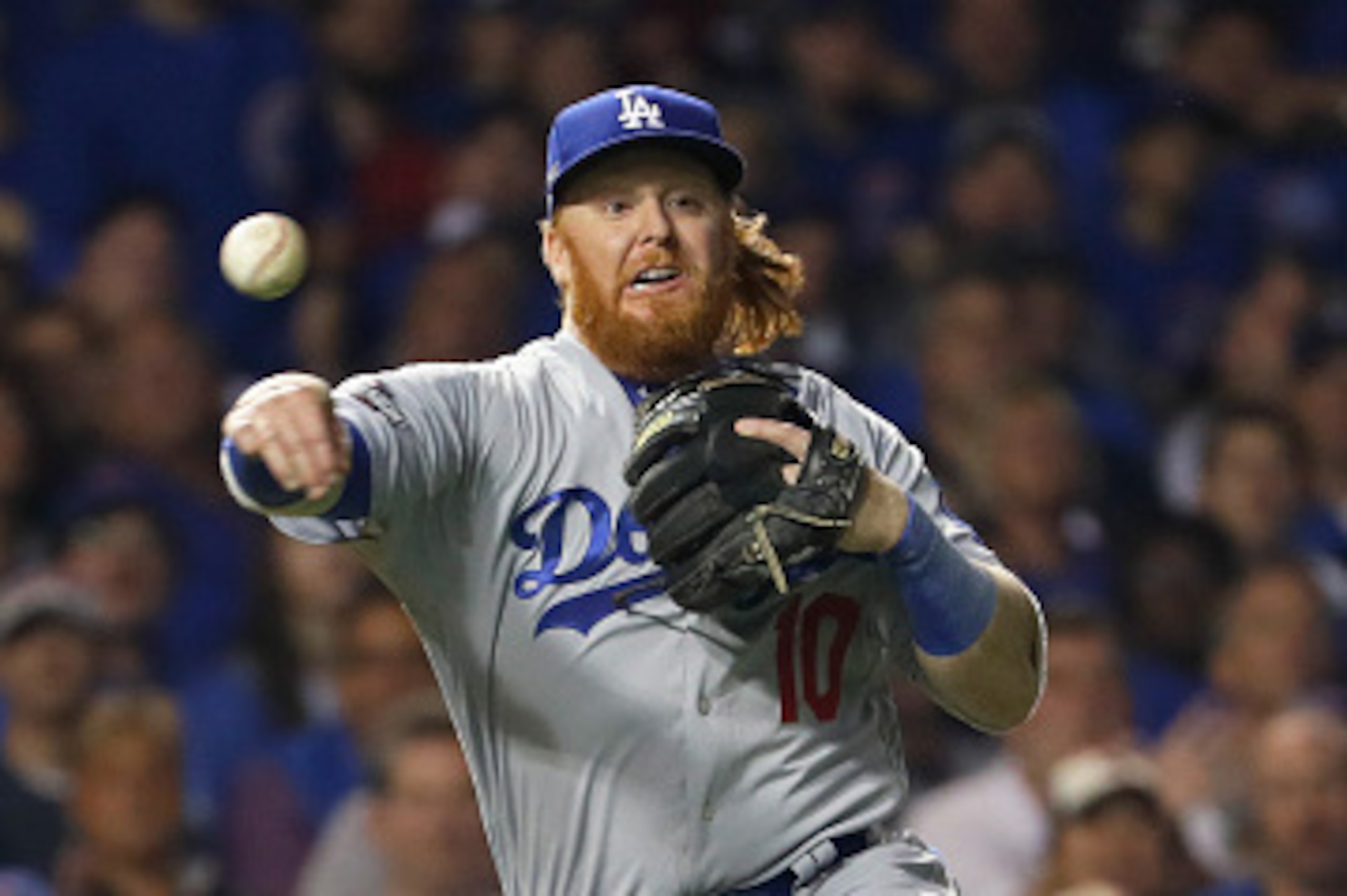CHICAGO, IL - OCTOBER 16: Justin Turner #10 of the Los Angeles Dodgers throws out Dexter Fowler #24 of the Chicago Cubs (not pictured) in the first inning during game two of the National League Championship Series at Wrigley Field on October 16, 2016 in CHICAGO, IL - OCTOBER 16: Justin Turner #10 of the Los Angeles Dodgers throws out Dexter Fowler #24 of the Chicago Cubs (not pictured) in the first inning during game two of the National League Championship Series at Wrigley Field on October 16, 2016 in