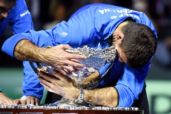TOPSHOT -  Argentina's Juan martin del Potro hugs the trophy after winning the Davis Cup World Group final between Croatia and Argentina on November 27, 2016 at the Arena hall in Zagreb.  / AFP / -        (Photo credit should read -/AFP/Getty Images)