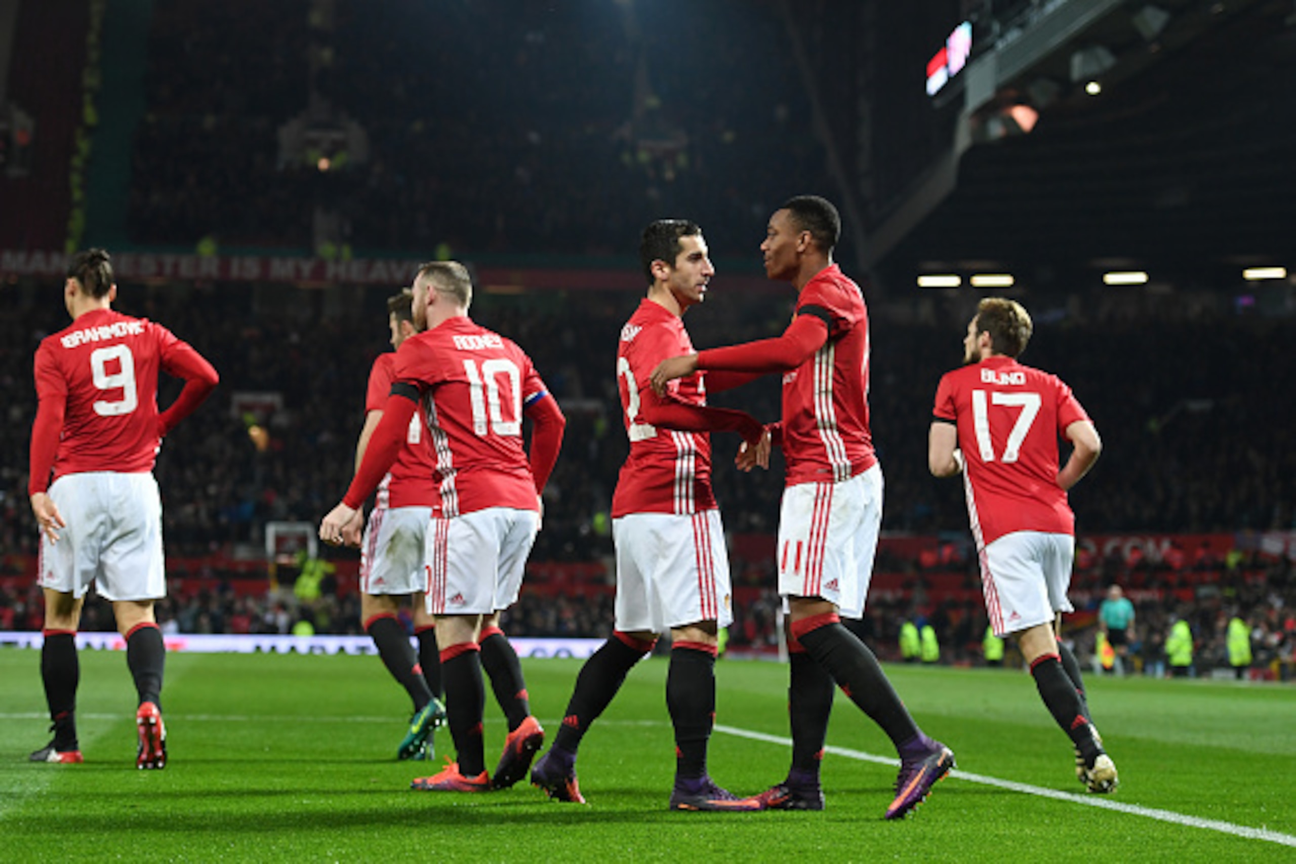 MANCHESTER, ENGLAND - NOVEMBER 30:  Anthony Martial of Manchester United celebrates with team mates after scoring his team's second goal of the game during the EFL Cup quarter final match between Manchester United and West Ham United at Old Trafford on No