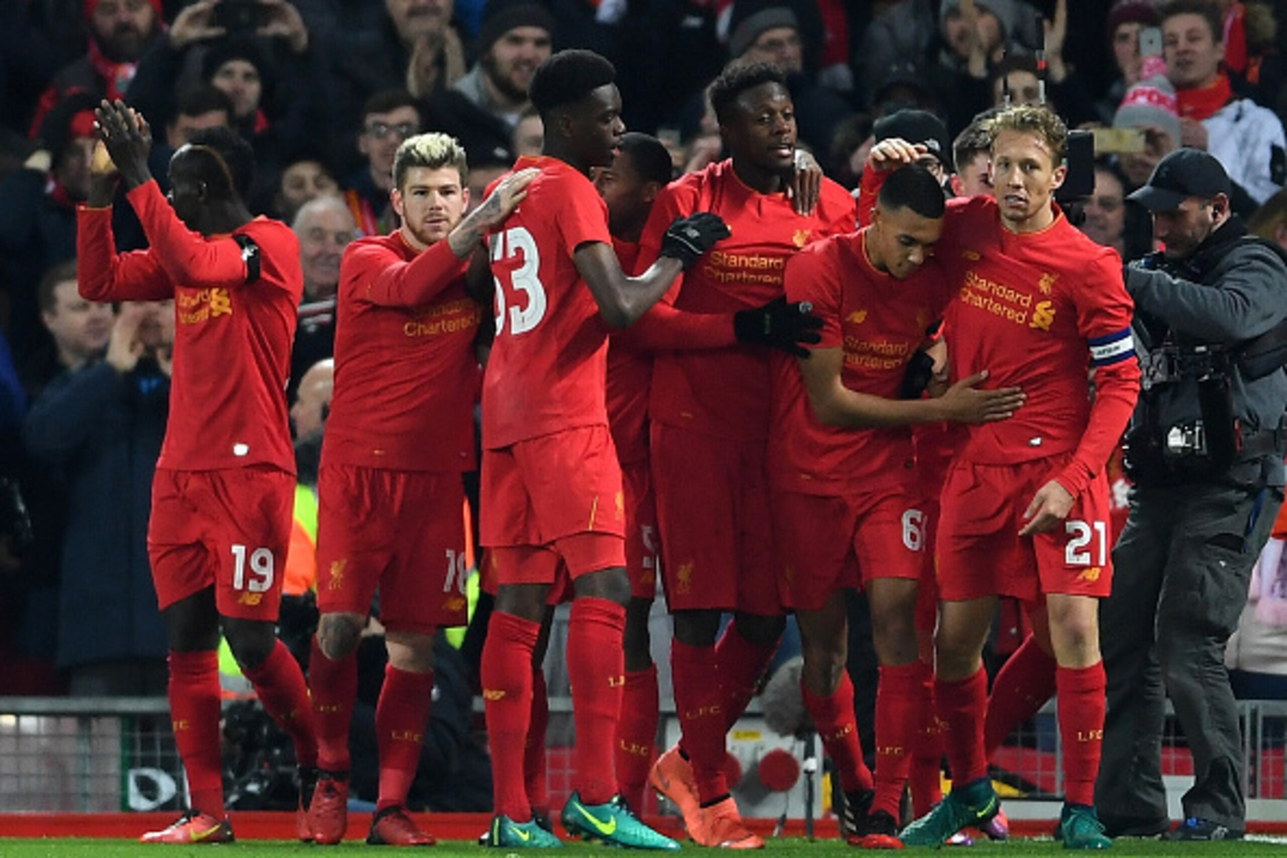 LIVERPOOL, ENGLAND - NOVEMBER 29:  Divock Origi of Liverpool (C) celebrates with team mates as he scores their first goal during the EFL Cup Quarter-Final match between Liverpool and Leeds United at Anfield on November 29, 2016 in Liverpool, England.  (Ph