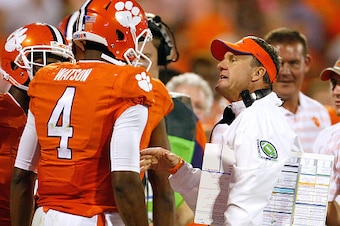 CLEMSON, SC - SEPTEMBER 27: Deshaun Watson #4 of the Clemson Tigers talks with Offensive Coordinator Chad Morris during the game against the North Carolina Tar Heels at Memorial Stadium on September 27, 2014 in Clemson, South Carolina. (Photo by Tyler Smi