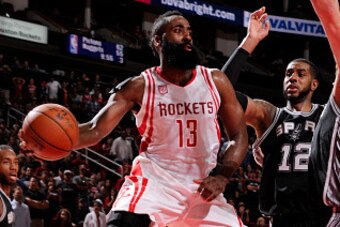 HOUSTON, TX - NOVEMBER 12:  James Harden #13 of the Houston Rockets passes the ball during a game against the San Antonio Spurs on November 12, 2016 at the Toyota Center in Houston, Texas. NOTE TO USER: User expressly acknowledges and agrees that, by down