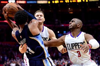 LOS ANGELES, CA - NOVEMBER 16:  Mike Conley #11 of the Memphis Grizzlies is fouled by Chris Paul #3 of the LA Clippers with Blake Griffin #32 after a rebound during the final seconds of the game at Staples Center on November 16, 2016 in Los Angeles, Calif