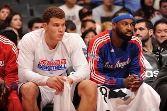 LOS ANGELES - DECEMBER 6:  Blake Griffin #32 and Baron Davis #5 of the Los Angeles Clippers sit on a bench and during the game against the Sacramento Kings at Staples Center on December 6, 2010 in Los Angeles, California. The Clippers won 98-91. NOTE TO U