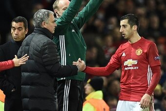 Manchester United's Armenian midfielder Henrikh Mkhitaryan (R) shakes hands with Manchester United's Portuguese manager Jose Mourinho (L) as he is substituted during the UEFA Europa League group A football match between Manchester United and Feyenoord at 