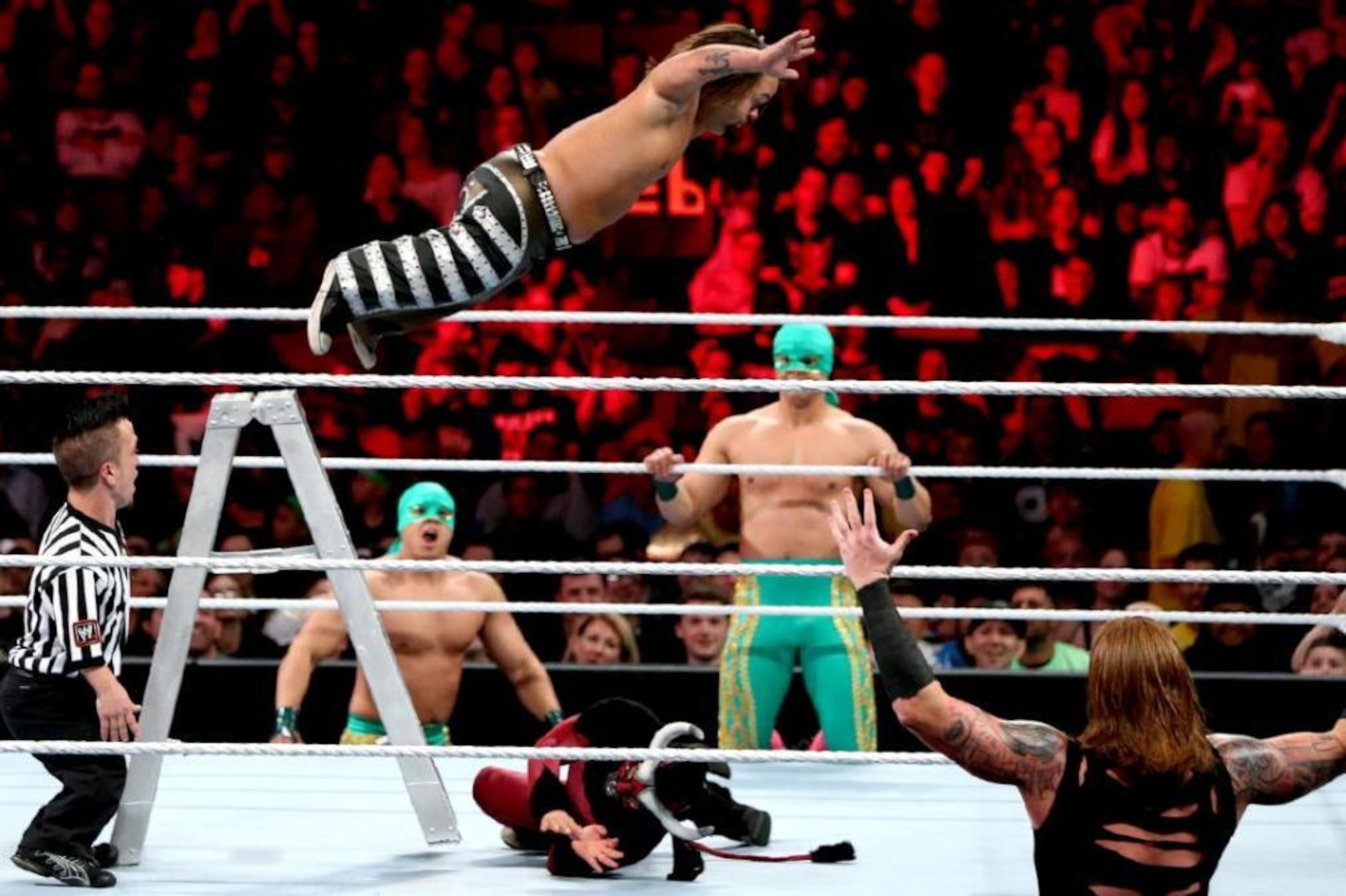 Hornswoggle (Dylan Postl) leaps from a ladder onto El Torito. Hornswoggle (Dylan Postl) leaps from a ladder onto El Torito.