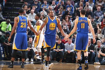 INDIANAPOLIS, IN - NOVEMBER 21:  Andre Iguodala #9 celebrates with Ian Clark #21 and Klay Thompson #11 of the Golden State Warriors during a game against the Indiana Pacers on November 21, 2016 at Bankers Life Fieldhouse in Indianapolis, Indiana. NOTE TO 