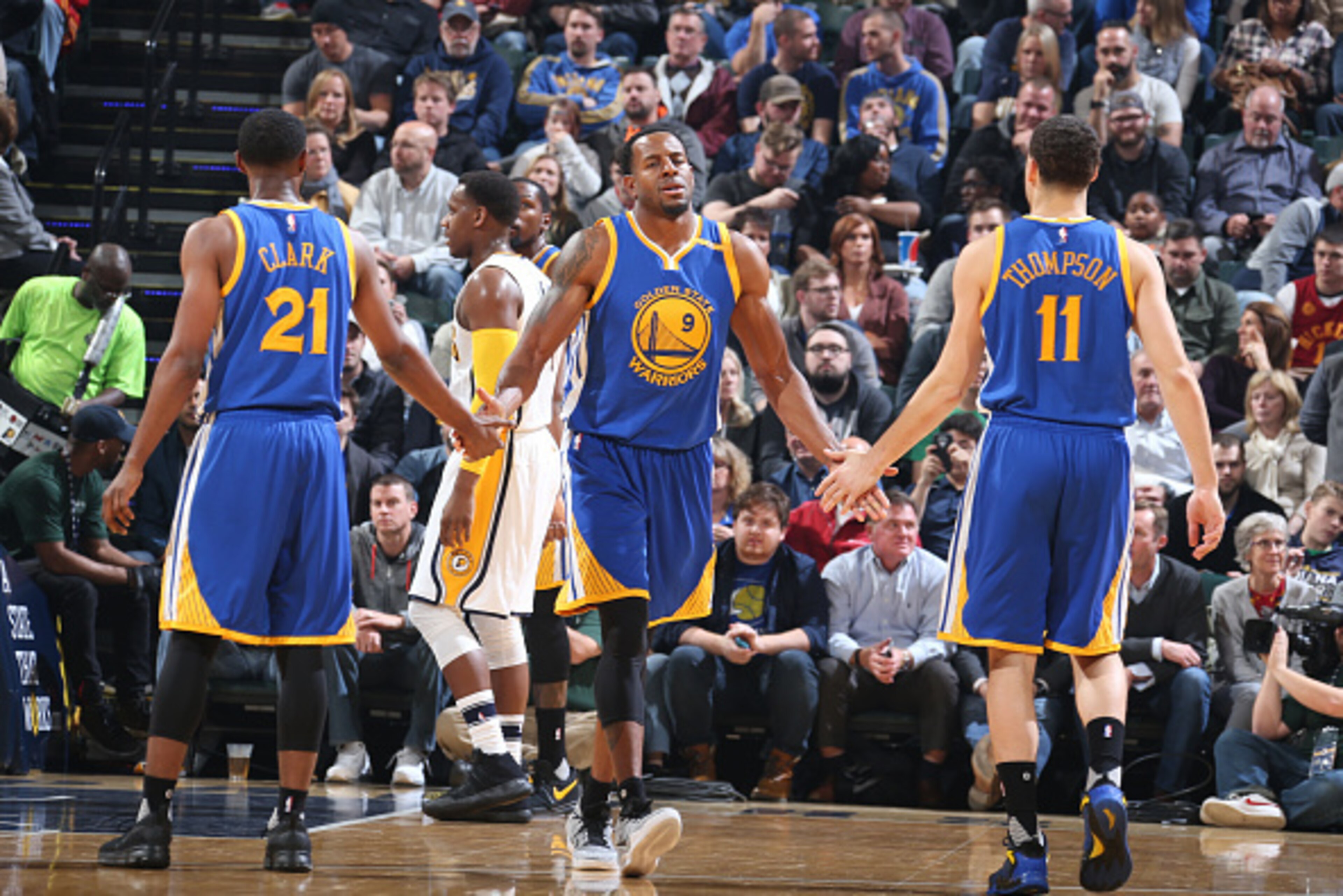 INDIANAPOLIS, IN - NOVEMBER 21: Andre Iguodala #9 celebrates with Ian Clark #21 and Klay Thompson #11 of the Golden State Warriors during a game against the Indiana Pacers on November 21, 2016 at Bankers Life Fieldhouse in Indianapolis, Indiana. NOTE TO INDIANAPOLIS, IN - NOVEMBER 21: Andre Iguodala #9 celebrates with Ian Clark #21 and Klay Thompson #11 of the Golden State Warriors during a game against the Indiana Pacers on November 21, 2016 at Bankers Life Fieldhouse in Indianapolis, Indiana. NOTE TO