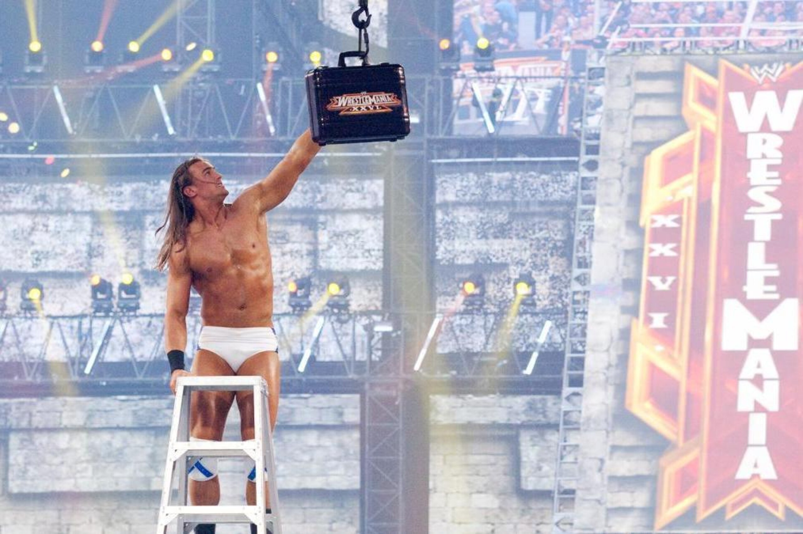 Drew Galloway attempts to retrieve the Money in the Bank briefcase at WrestleMania XXVI. Drew Galloway attempts to retrieve the Money in the Bank briefcase at WrestleMania XXVI.