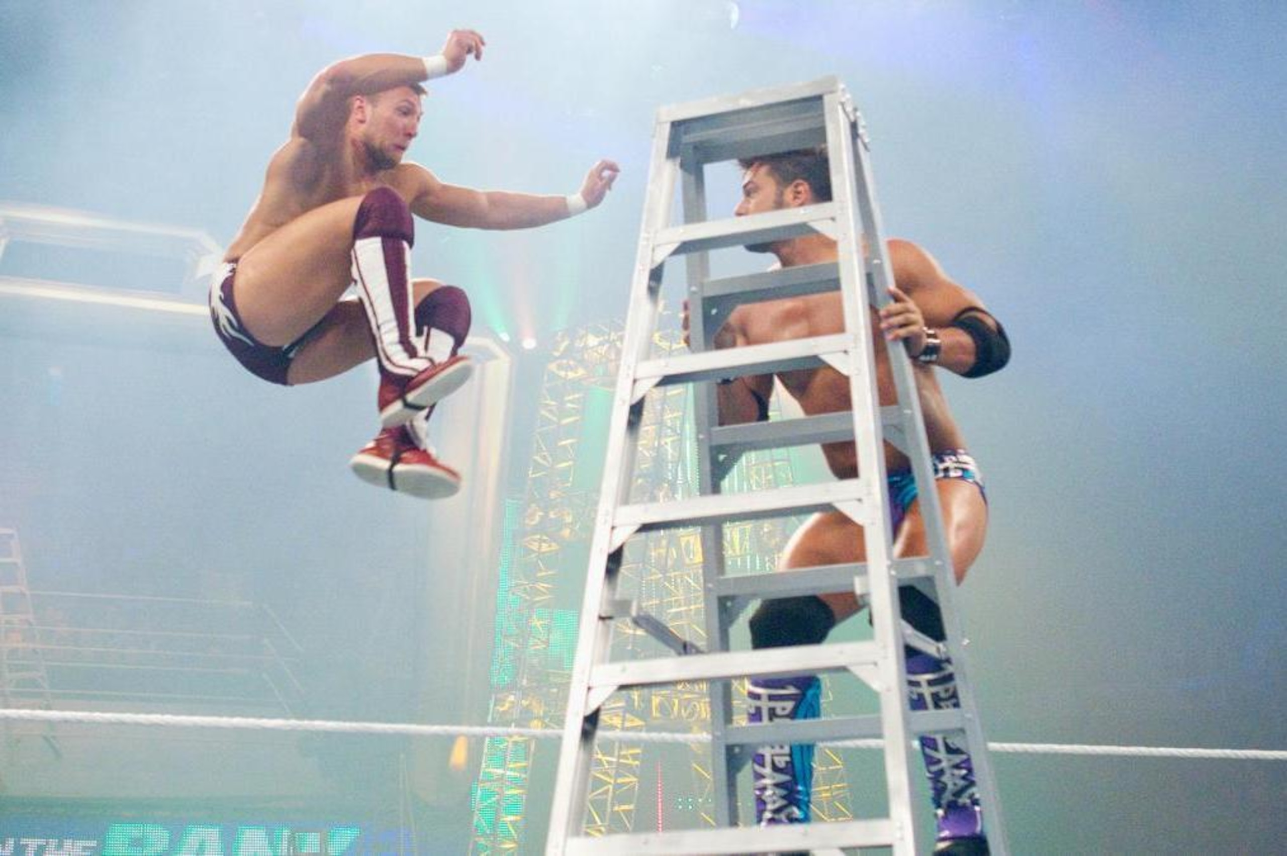 Daniel Bryan leaps at Justin Gabriel during a Money in the Bank ladder match. Daniel Bryan leaps at Justin Gabriel during a Money in the Bank ladder match.