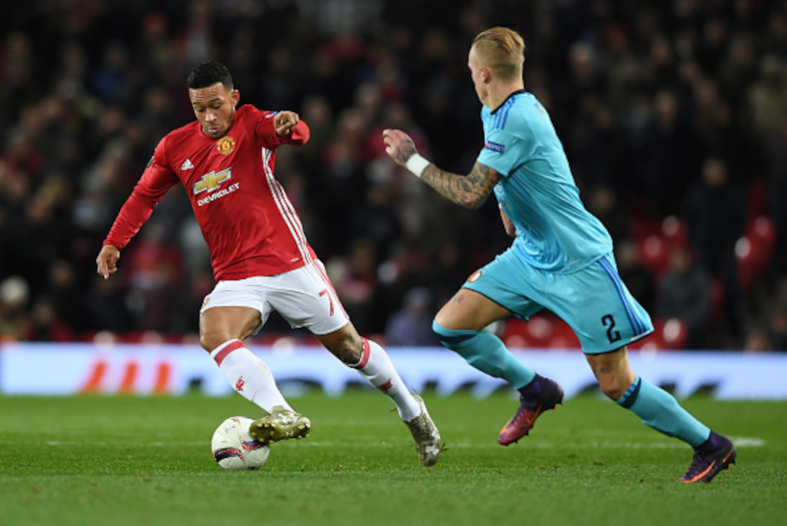 MANCHESTER, ENGLAND - NOVEMBER 24:  Memphis Depay of Manchester United is watched by Rick Karsdorp of Feyenoord during the UEFA Europa League Group A match between Manchester United FC and Feyenoord at Old Trafford on November 24, 2016 in Manchester, Engl
