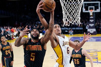 LOS ANGELES, CA - NOVEMBER 27: Malcolm Delaney #5 of the Atlanta Hawks and Jordan Clarkson #6 of the Los Angeles Lakers battle for the ball during the second half of the basketball game at Staples Center November 27 2016, in Los Angeles, California. NOTE 