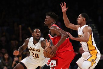 LOS ANGELES, CA - NOVEMBER 20:  Tarik Black #28 and Jordan Clarkson #6 of the Los Angeles Lakers defend Jimmy Butler #21 of the Chicago Bulls during the second half of the NBA game at Staples Center on November 20, 2016 in Los Angeles, California. The Bul