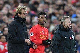 Liverpool's English striker Daniel Sturridge (C) stands alongside Liverpool's German manager Jurgen Klopp (L) as he waits to be substituted on to the pitch during the English Premier League football match between Liverpool and Watford at Anfield in Liverp