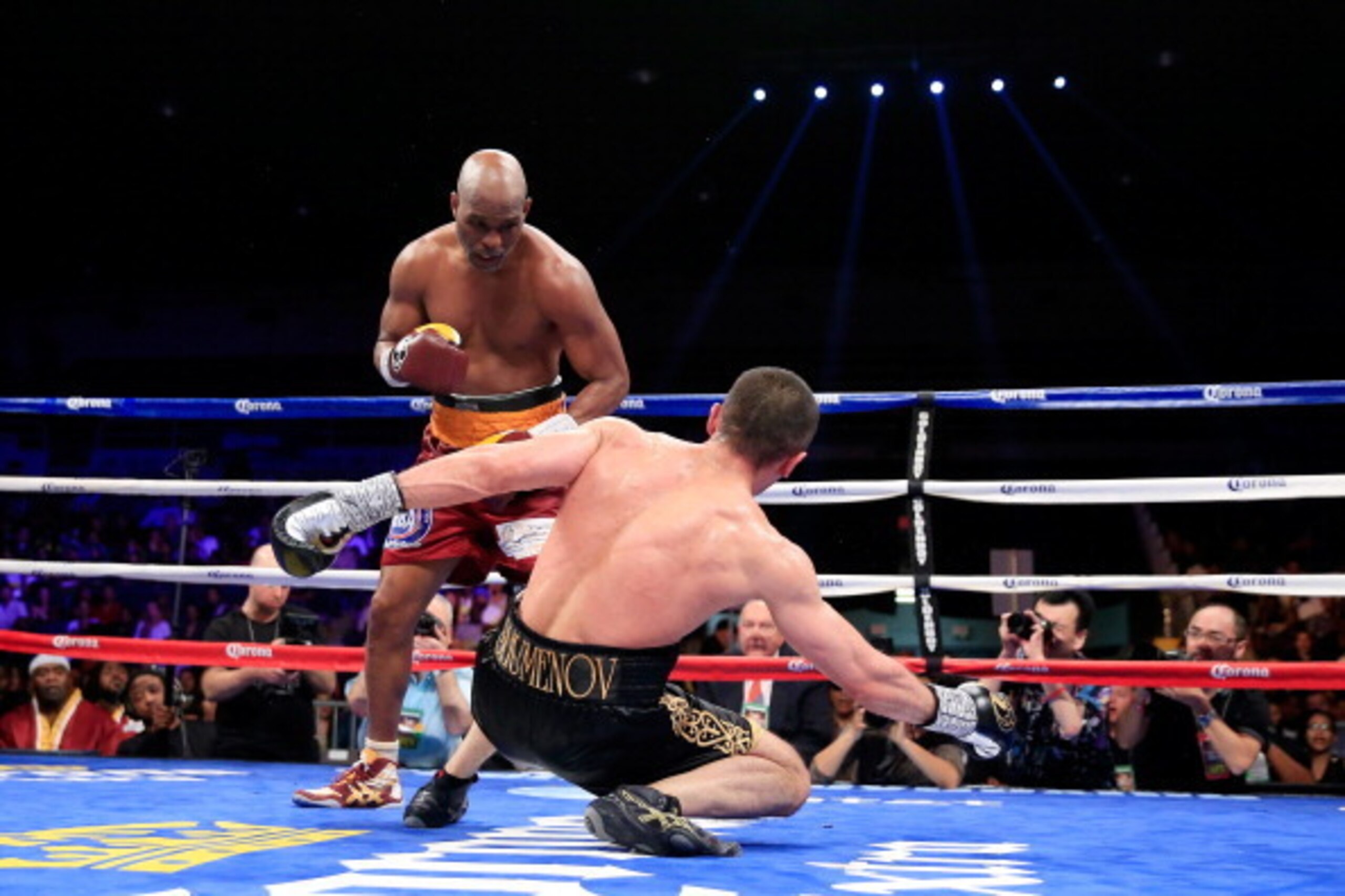 WASHINGTON, DC - APRIL 19:  Bernard Hopkins (L) knocks down Beibut Shumenov during the 10th round of their IBA Light Heavyweight Title fight on April 19, 2014 in Washington, DC. Hopkins won a split decision in 12 rounds.  (Photo by Rob Carr/Getty Images)