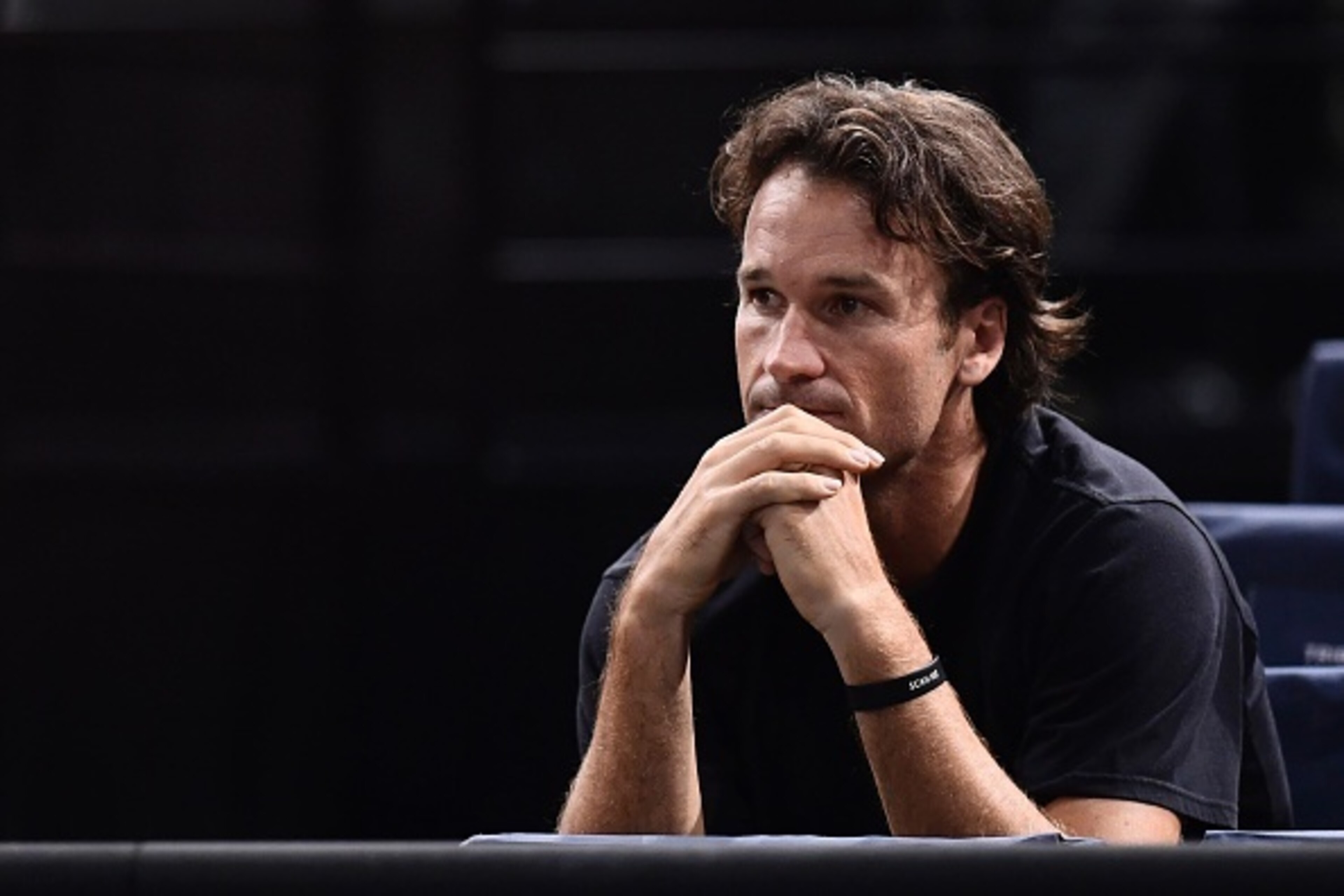Carlos Moya, former Spanish tennis player and coach of Canada's Milos Raonic, attends his quarter-final tennis match against France's Jo-Wilfried Tsonga at the ATP World Tour Masters 1000 indoor tournament in Paris on November 4, 2016. / AFP / MIGUEL MEDI