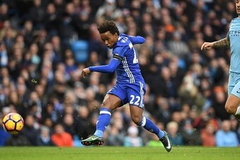 Chelsea's Brazilian midfielder Willian shoots past Manchester City's Serbian defender Aleksandar Kolarov to score his team's second goal during the English Premier League football match between Manchester City and Chelsea at the Etihad Stadium in Manchest