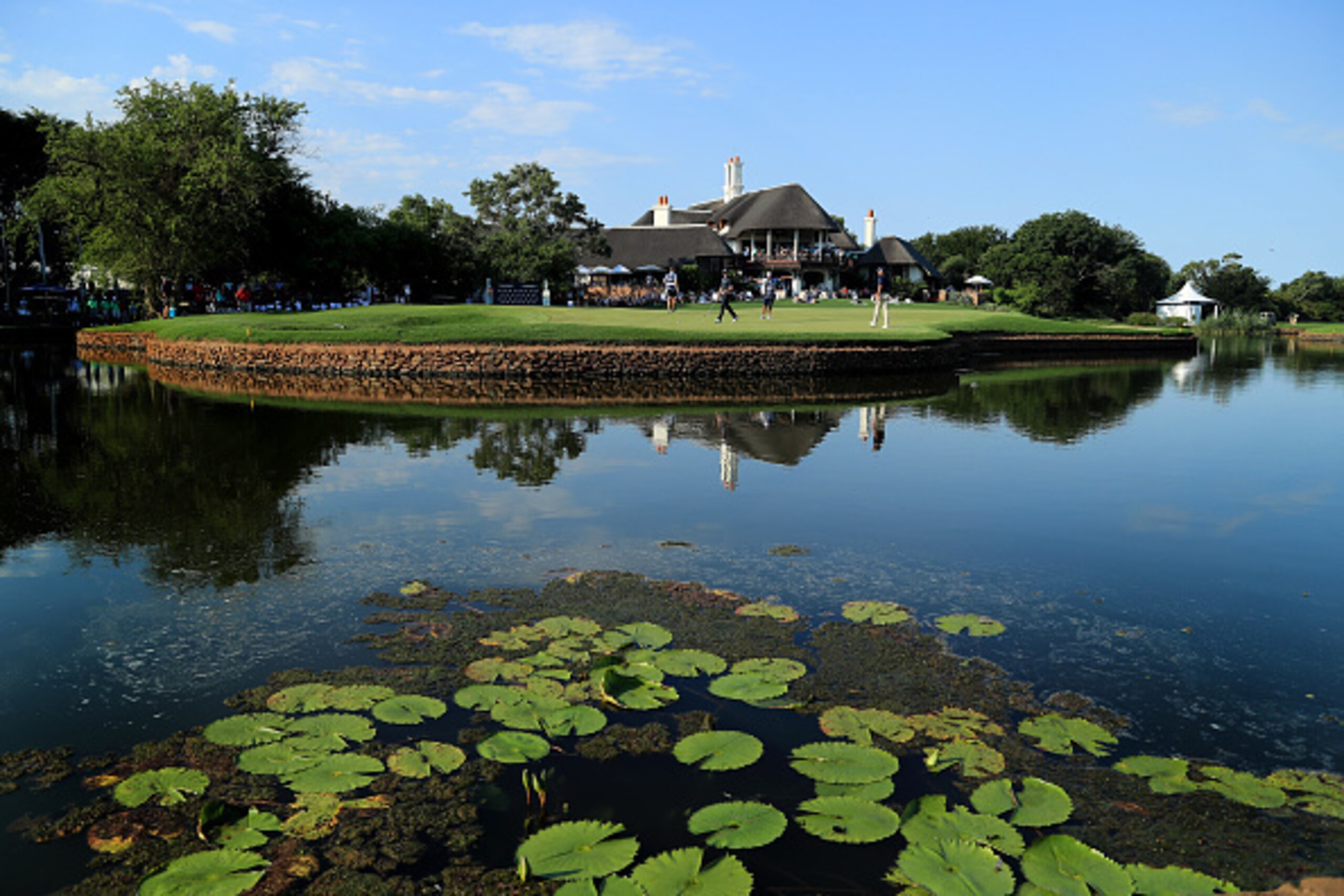 MALELANE, SOUTH AFRICA - DECEMBER 03:  Brandon Stone and Charl Schwartzel of South Africa putt out on the 18th green during the third round of the Alfred Dunhill Championships at Leopard Creek Country Golf Club on December 3, 2016 in Malelane, South Afric