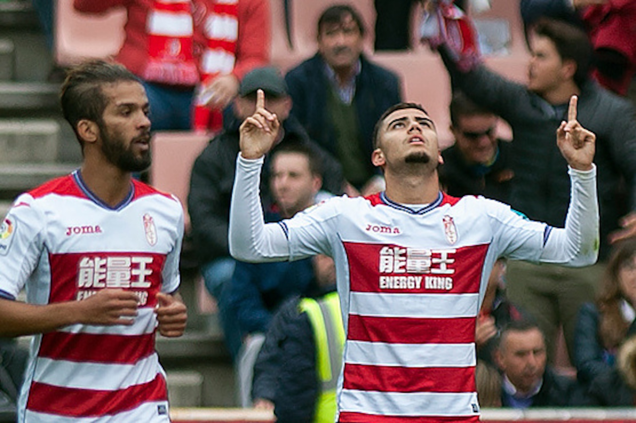 Granada's Belgian midfielder Andreas Pereira (R) celebrates a goal beside Granada's Moroccan midfielder Mehdi Carcela during the Spanish league football match Granada CF vs Sevilla FC at Nuevo Los Carmenes stadium in Granada on December 3, 2016. / AFP / J