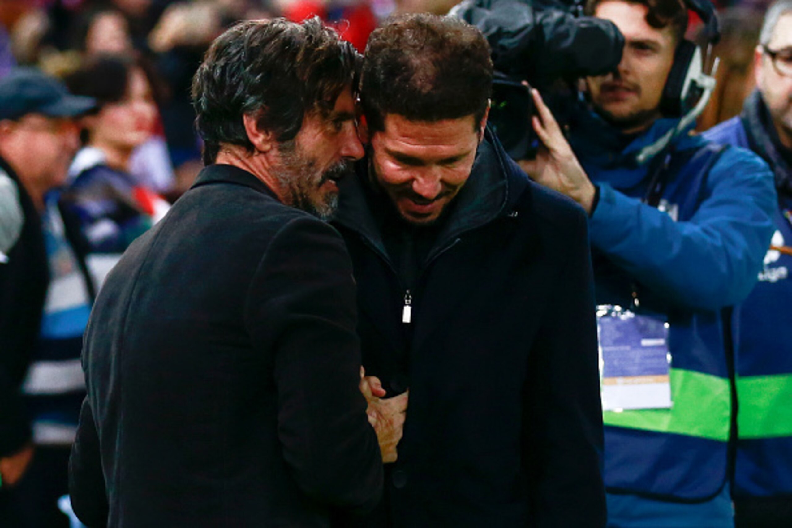 MADRID, SPAIN - DECEMBER 03: coach Enrique Sanchez Flores (L) of RCD Espanyol clashes hands with coach Diego Pablo Simeone (R) of Atletico de Madrid prior to start the La Liga match between Club Atletico de Madrid and RCD Espanyol at Vicente Calderon stad
