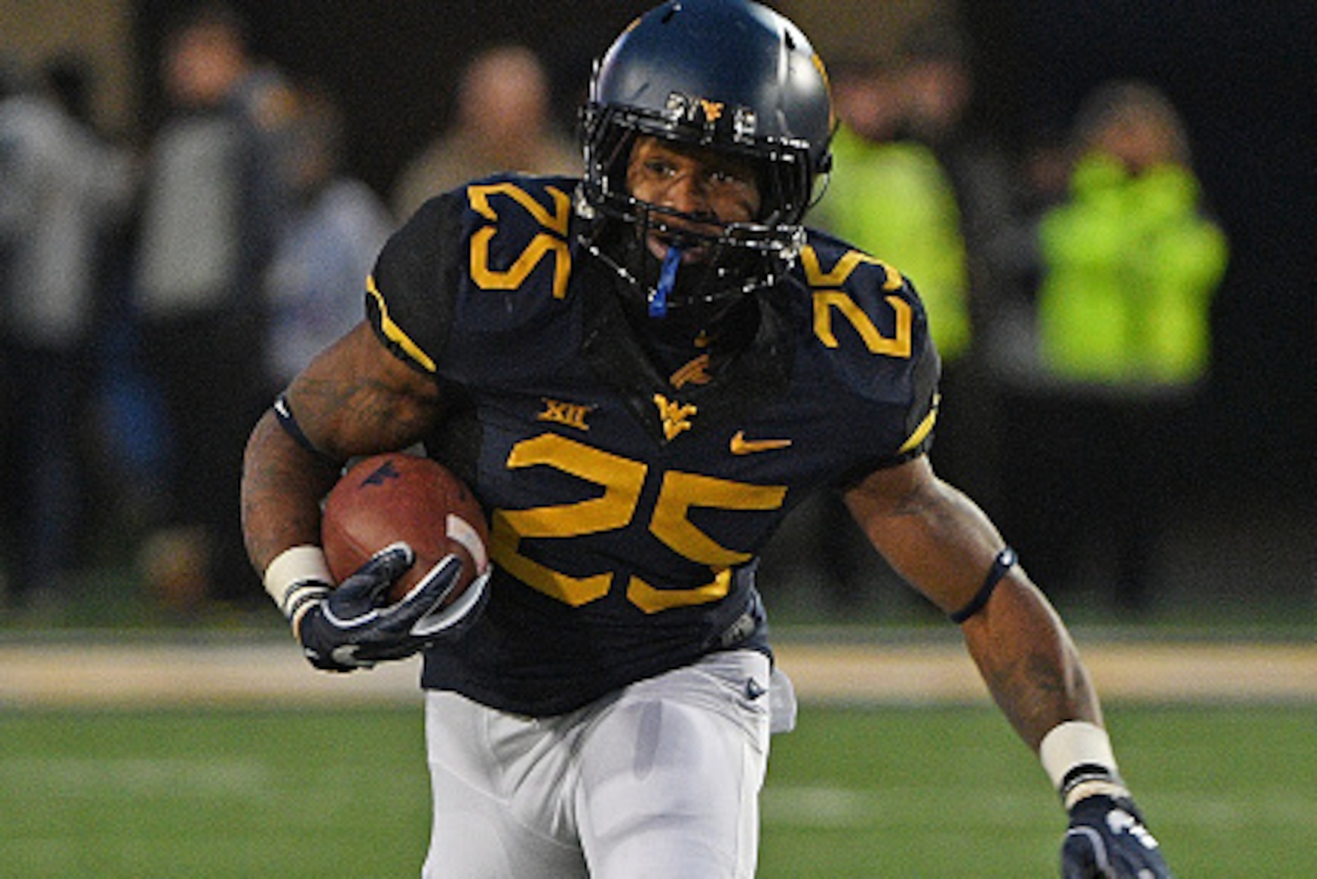 MORGANTOWN, WV - DECEMBER 03:  Justin Crawford #25 of the West Virginia Mountaineers rushes in open field in the second quarter during the game against the Baylor Bears at Mountaineer Field on December 3, 2016 in Morgantown, West Virginia. (Photo by Justi